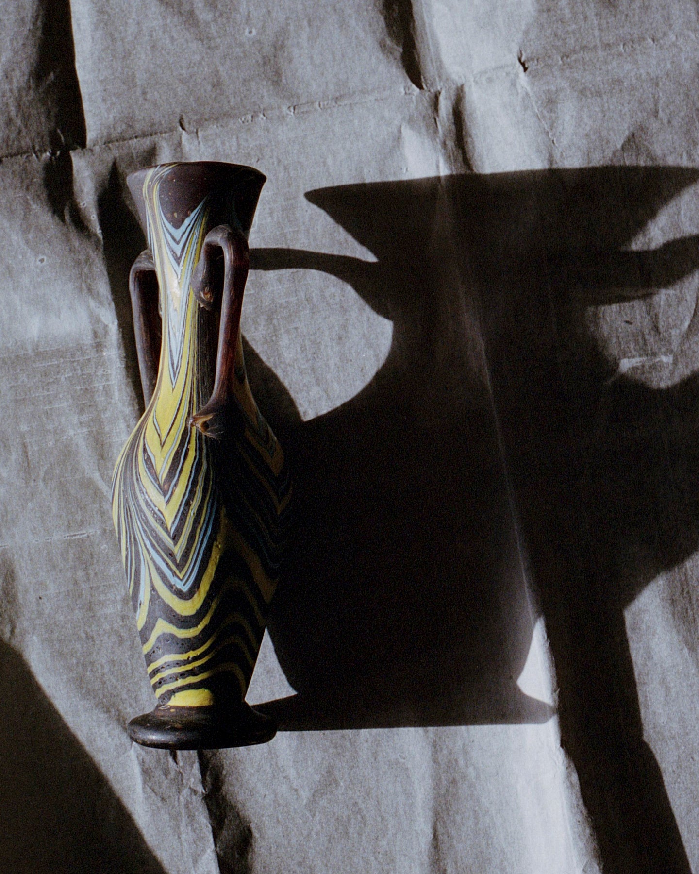 Phoenician glass vase - black, yellow and blue.